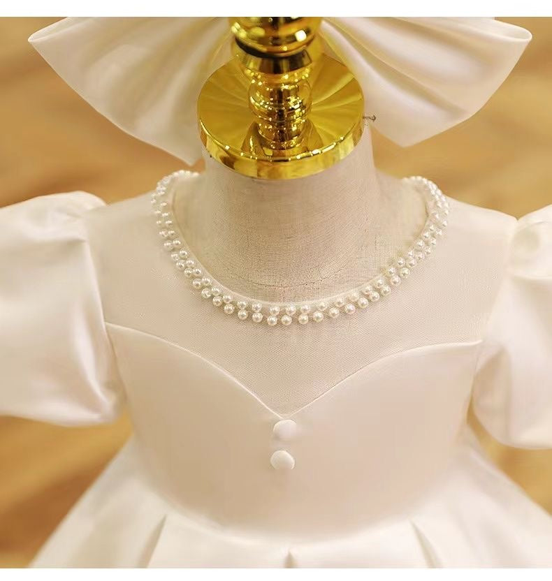 Elegant satin dress with piff sleeves and big removable bow at back