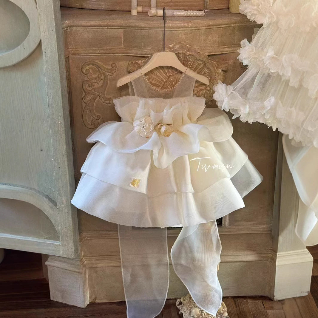 Ivory petal cloud dress with big bow at back and 3 flowers at waist