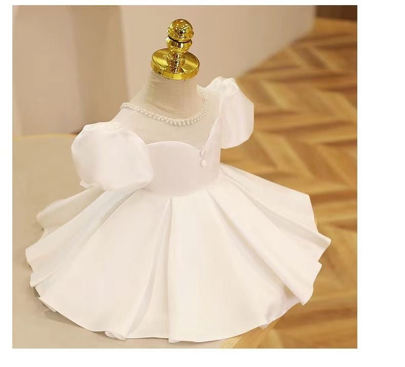 Elegant satin dress with piff sleeves and big removable bow at back