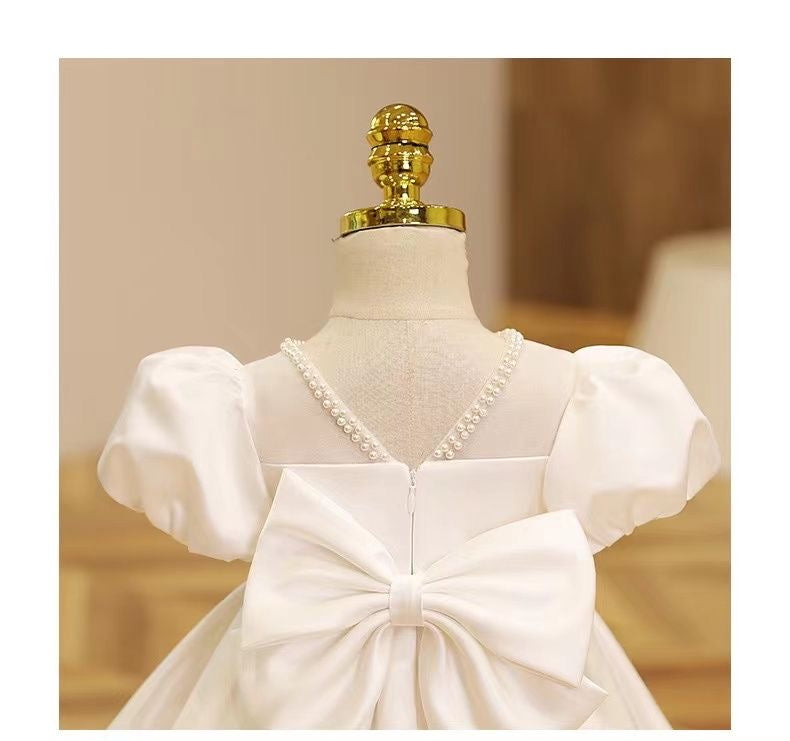 Elegant satin dress with piff sleeves and big removable bow at back