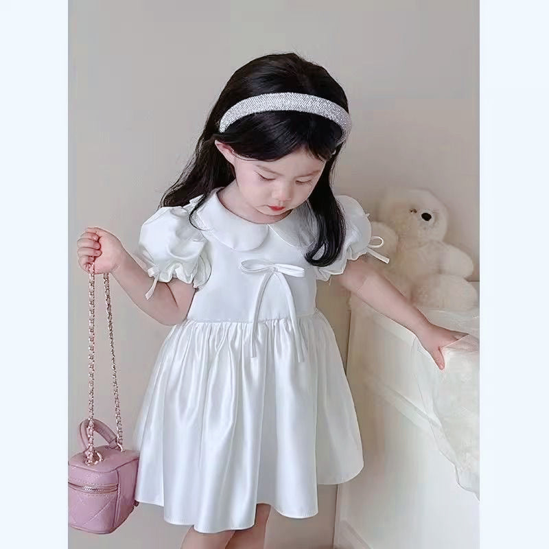 Elegant satin dress with cute bows and puffy sleeves and doll collar