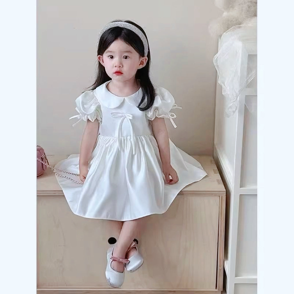 Elegant satin dress with cute bows and puffy sleeves and doll collar