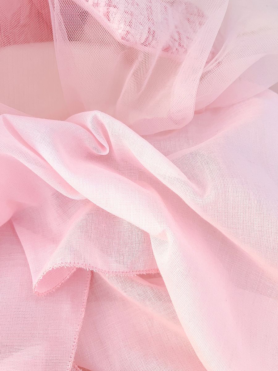 long sleeve dress with tulle skirt , 2 bows at chest .