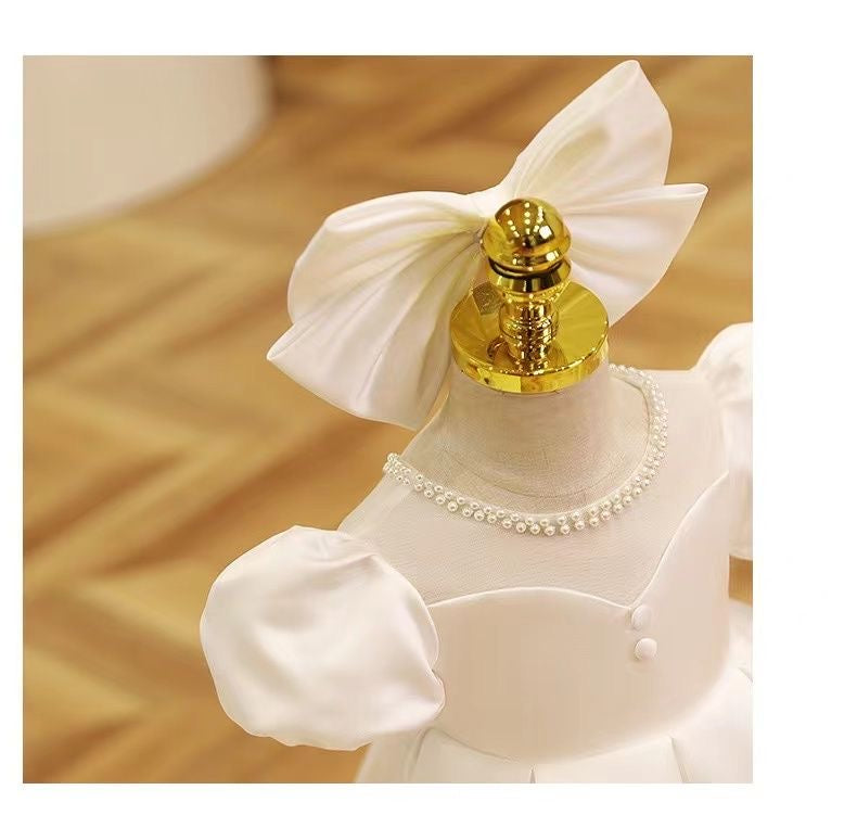 Elegant satin dress with piff sleeves and big removable bow at back