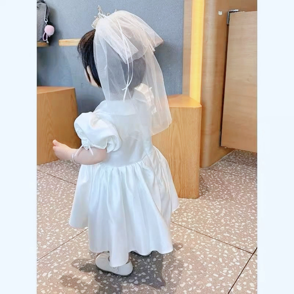 Elegant satin dress with cute bows and puffy sleeves and doll collar