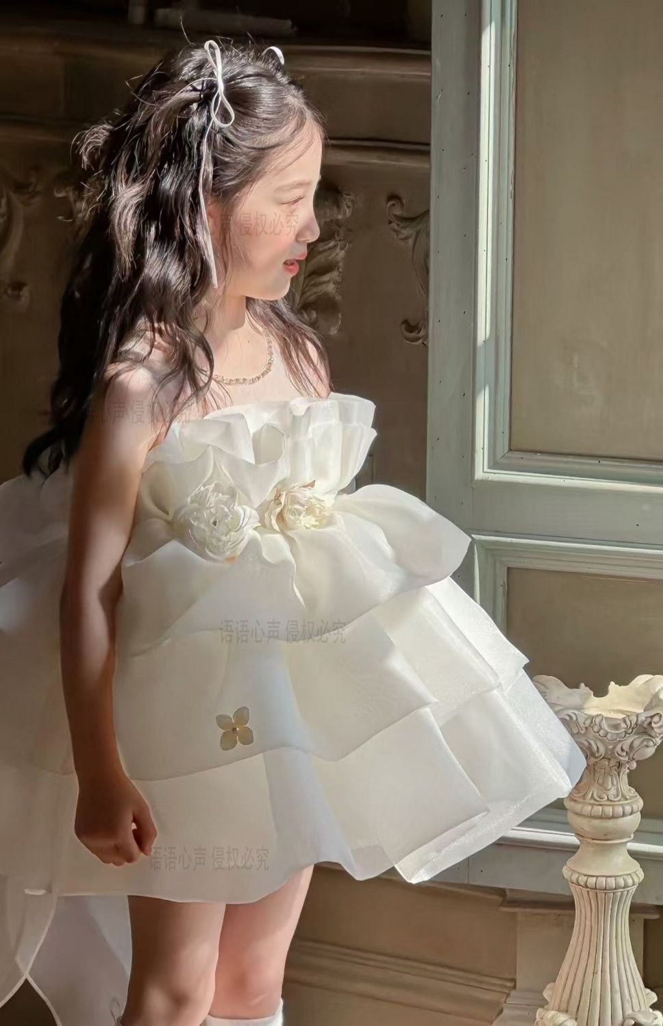 Ivory petal cloud dress with big bow at back and 3 flowers at waist
