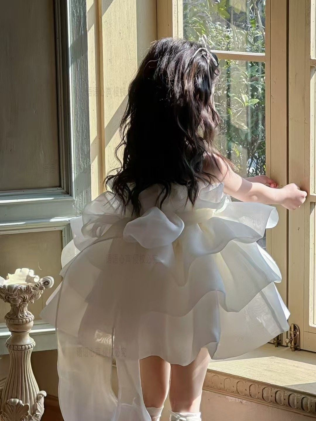 Ivory petal cloud dress with big bow at back and 3 flowers at waist