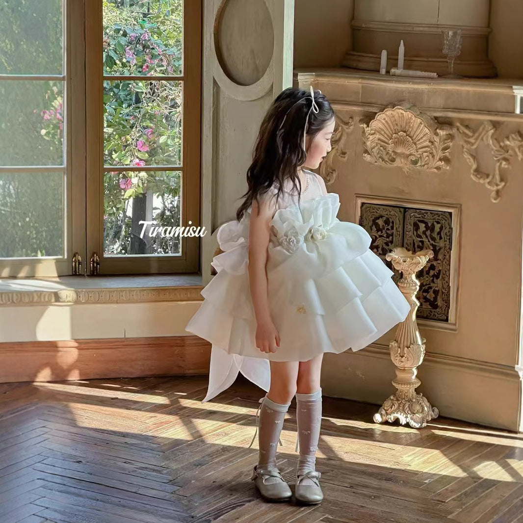 Ivory petal cloud dress with big bow at back and 3 flowers at waist