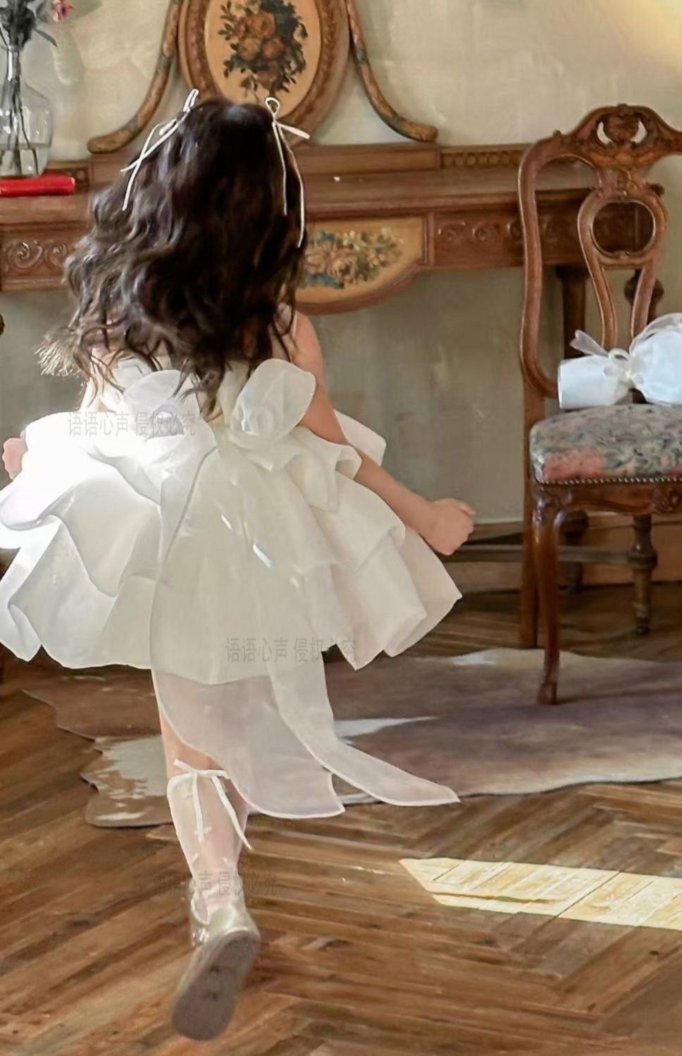 Ivory petal cloud dress with big bow at back and 3 flowers at waist