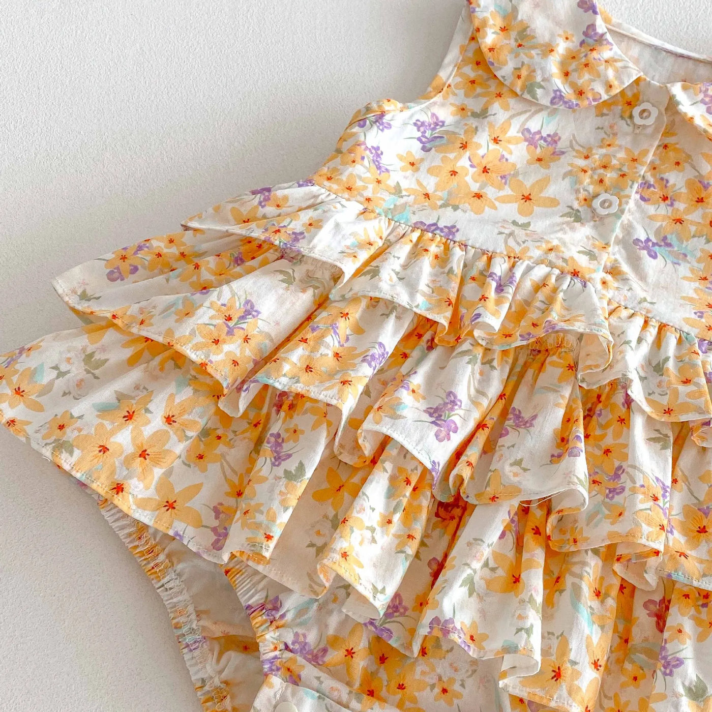 Baby collared floral romper dress with layered ruffles