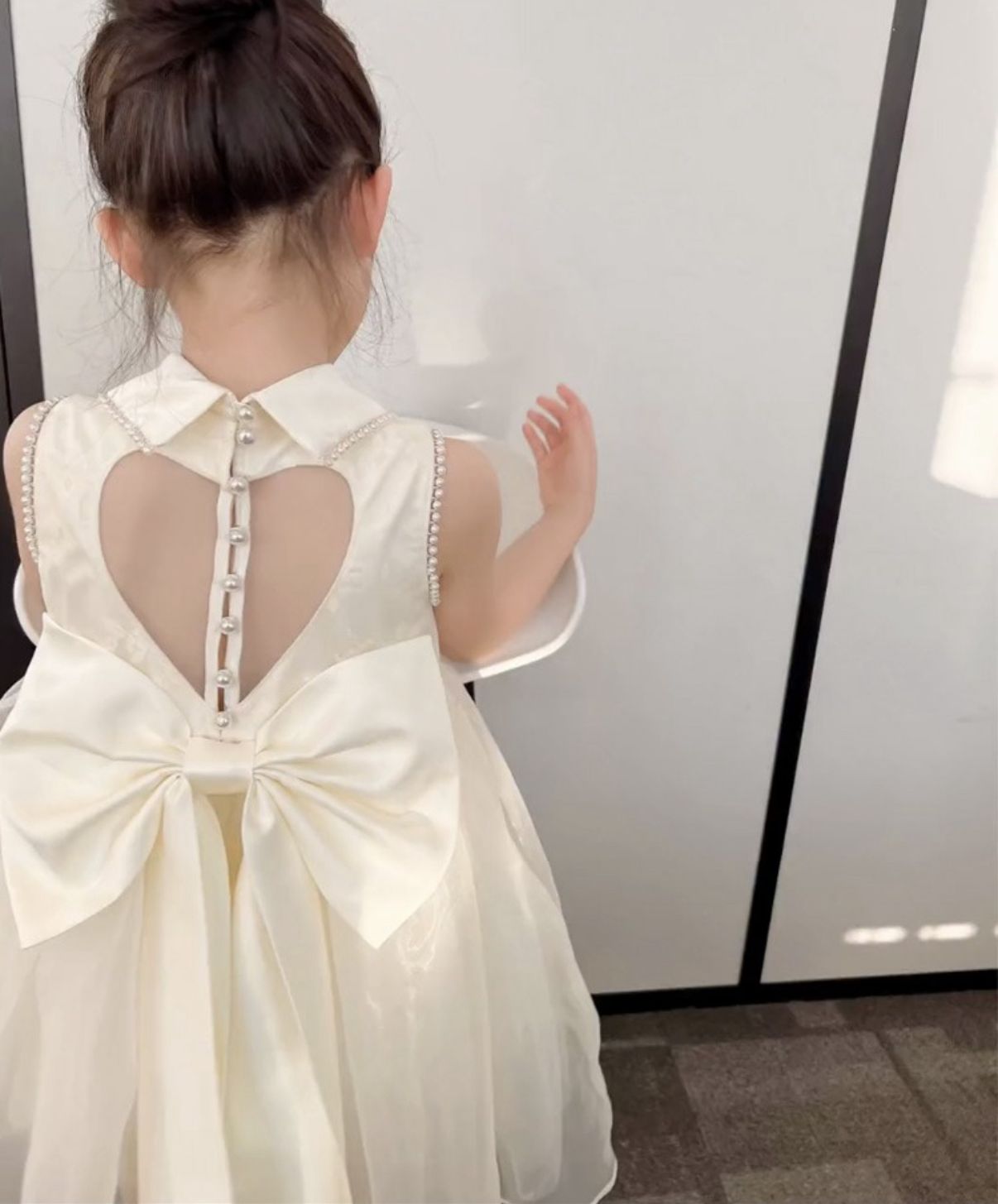 Party dress with see through back and heart shape, with  big bow knot at back and pearls beige color