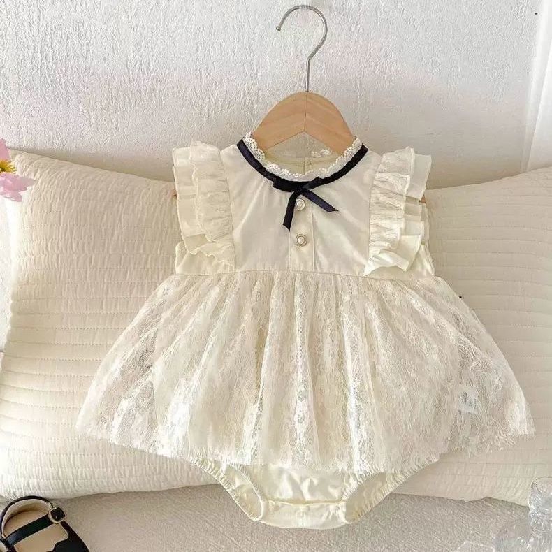 Beige baby sleeveless romper dress with black ribbon bow