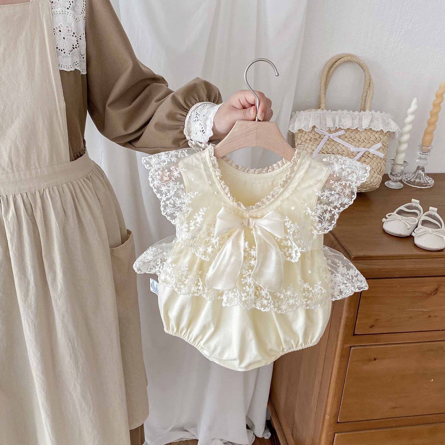 Beige baby romper dress with lace collar and bow knot
