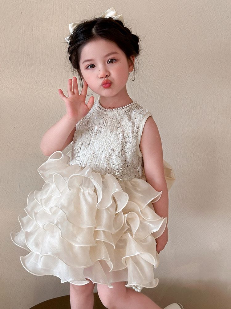 beige multi-layered princess dress with removable big bow at back