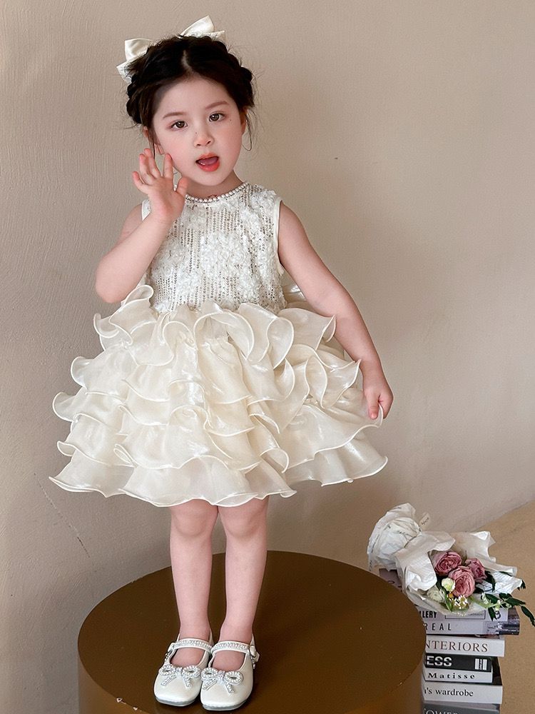 beige multi-layered princess dress with removable big bow at back