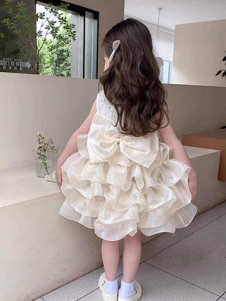 beige multi-layered princess dress with removable big bow at back