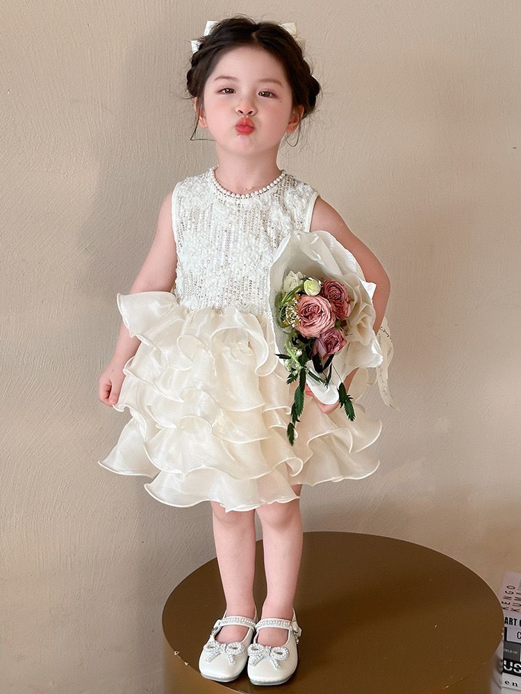 beige multi-layered princess dress with removable big bow at back