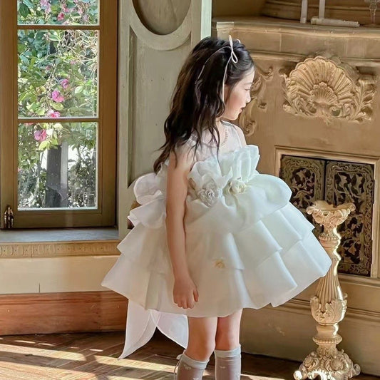 Ivory petal cloud dress with big bow at back and 3 flowers at waist
