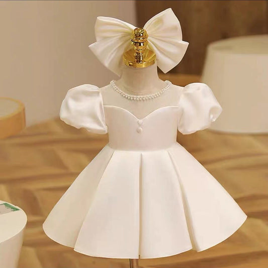 Elegant satin dress with piff sleeves and big removable bow at back