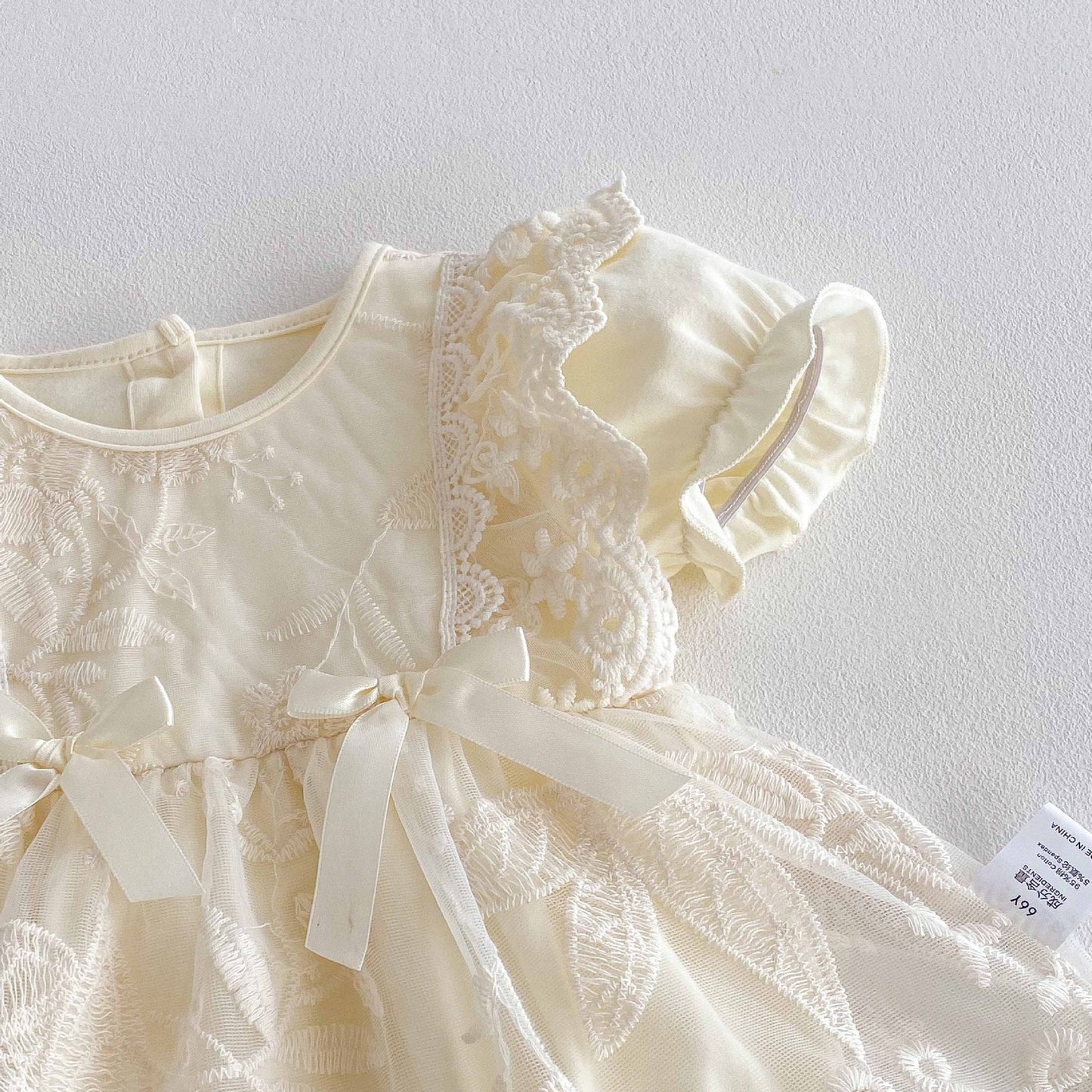 Short ruffle sleevelave  romper dress 2 ribbon bows beige