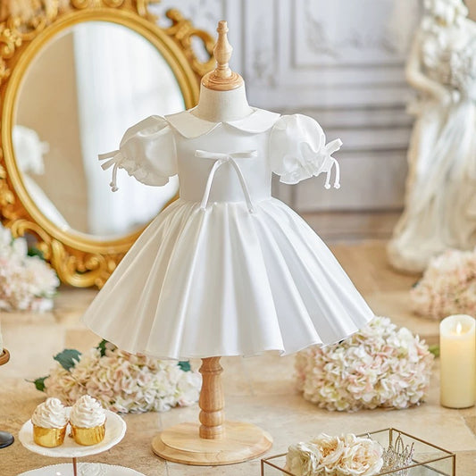 Elegant satin dress with cute bows and puffy sleeves and doll collar