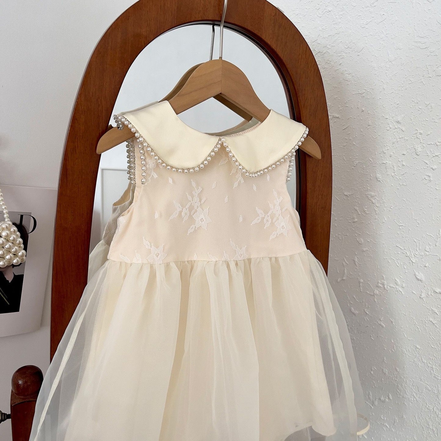 Party dress with see through back and heart shape, with  big bow knot at back and pearls beige color
