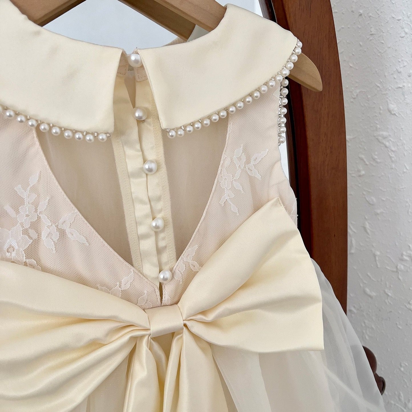 Party dress with see through back and heart shape, with  big bow knot at back and pearls beige color