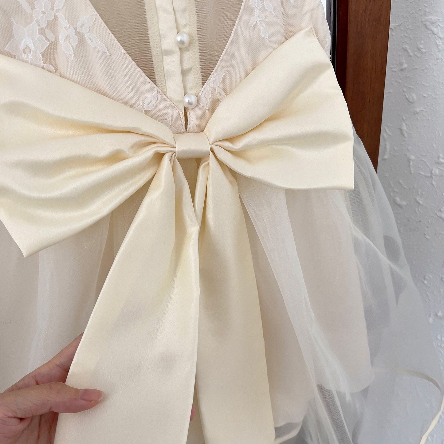 Party dress with see through back and heart shape, with  big bow knot at back and pearls beige color