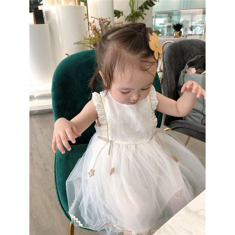 White princess dress with gold stars hanging