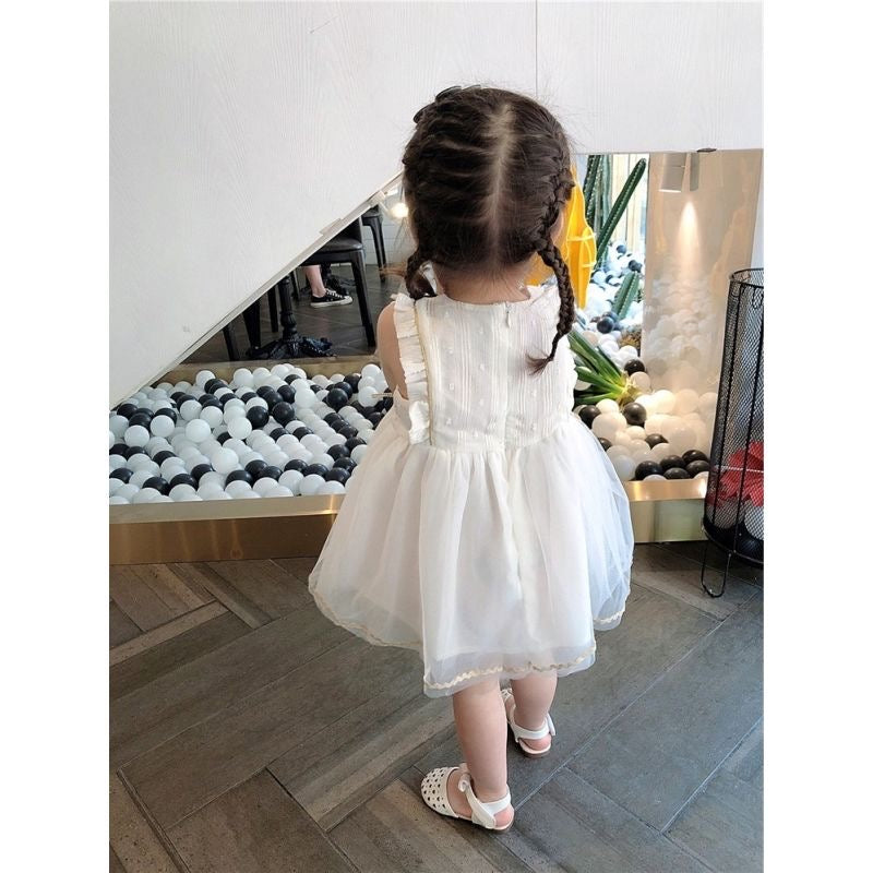 White princess dress with gold stars hanging