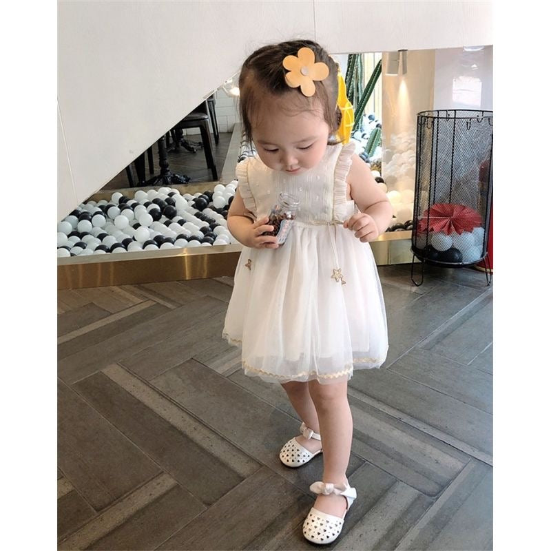 White princess dress with gold stars hanging