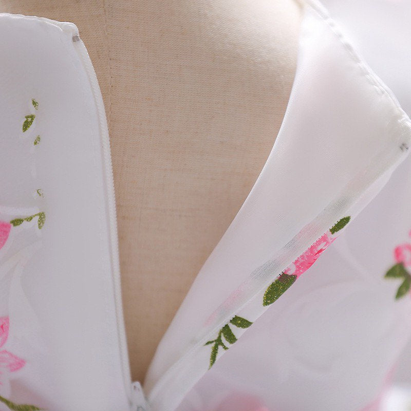 Girl white dress with pink flowers